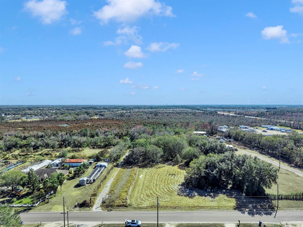 10611 Sumner Road Wimauma, FL 33598 - Photo 2 of 30 an aerial view of multiple house
