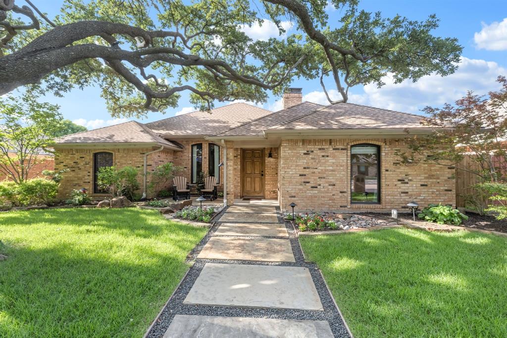 3913 Dome Drive Addison, TX 75001 - Photo 1 of 1 Brick exterior featuring a gabled roof and arched windows