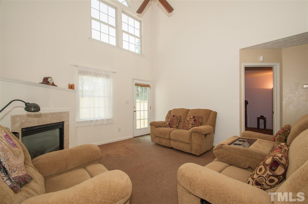 2232 Springhill Avenue Raleigh, NC 27603 - Photo 7 of 19 a living room with furniture window and flowerpot