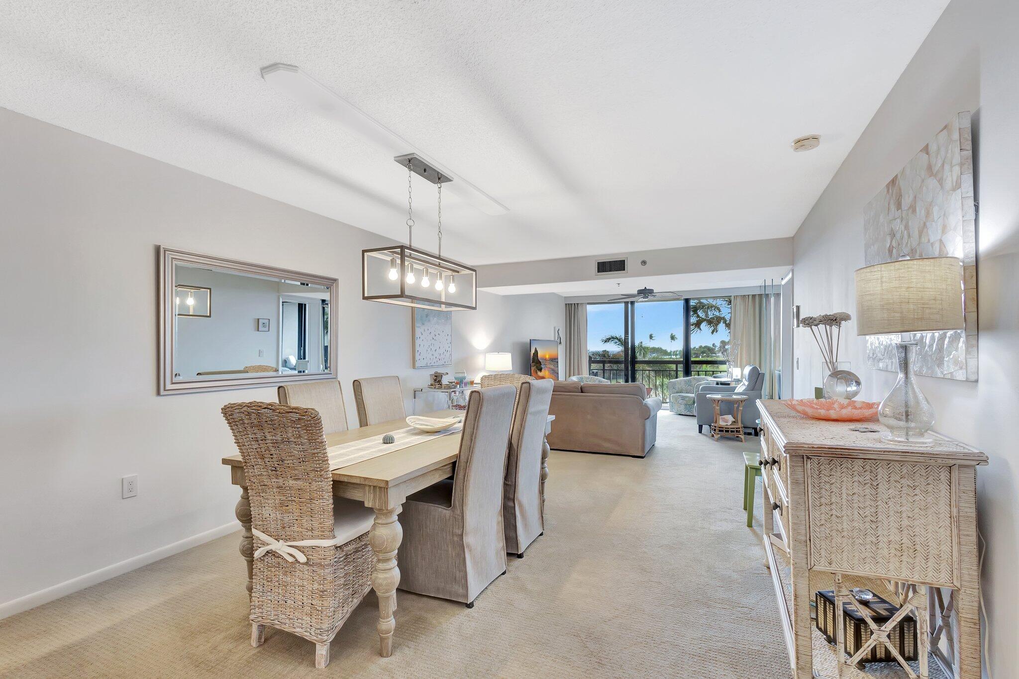 201 South Seas Drive, Unit 302 Jupiter, FL 33477 - Photo 11 of 19 a dining room with furniture and view of kitchen