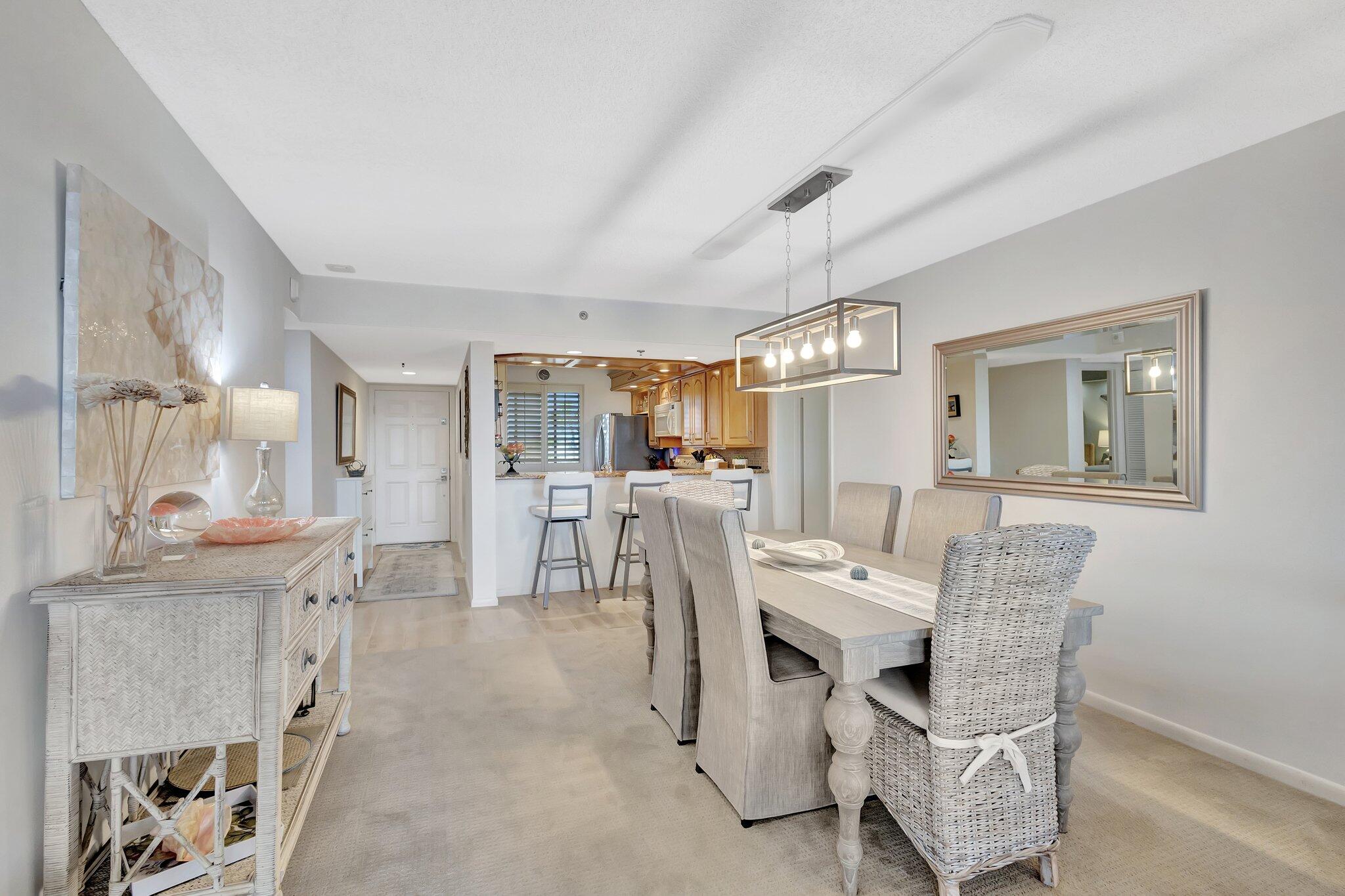 201 South Seas Drive, Unit 302 Jupiter, FL 33477 - Photo 12 of 19 a view of a dining room with furniture