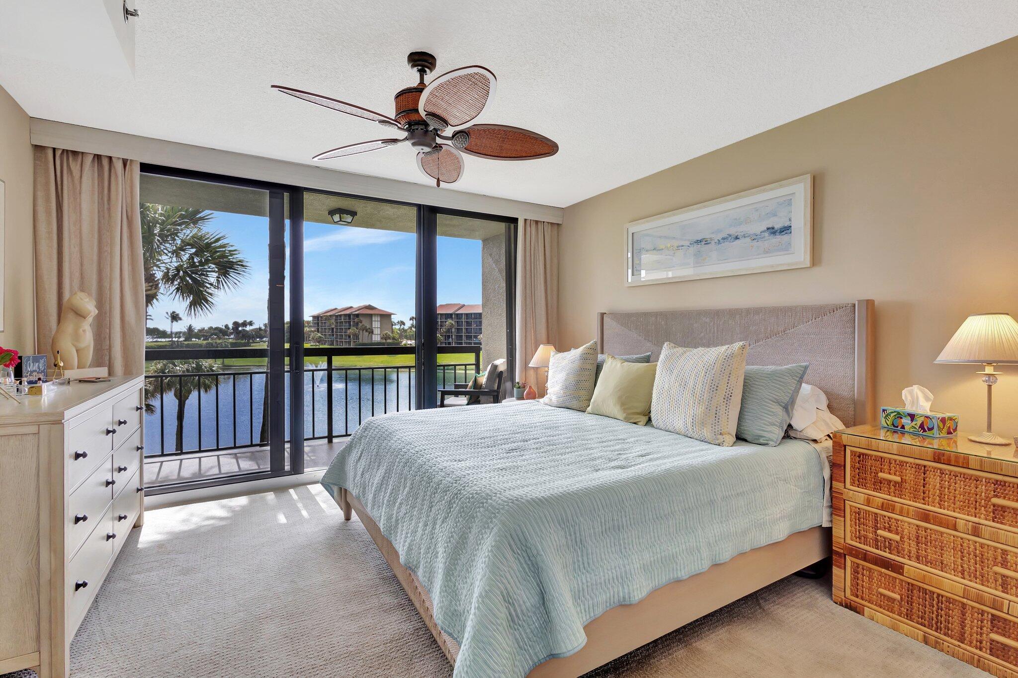 201 South Seas Drive, Unit 302 Jupiter, FL 33477 - Photo 19 of 19 a bedroom with a bed and a large window