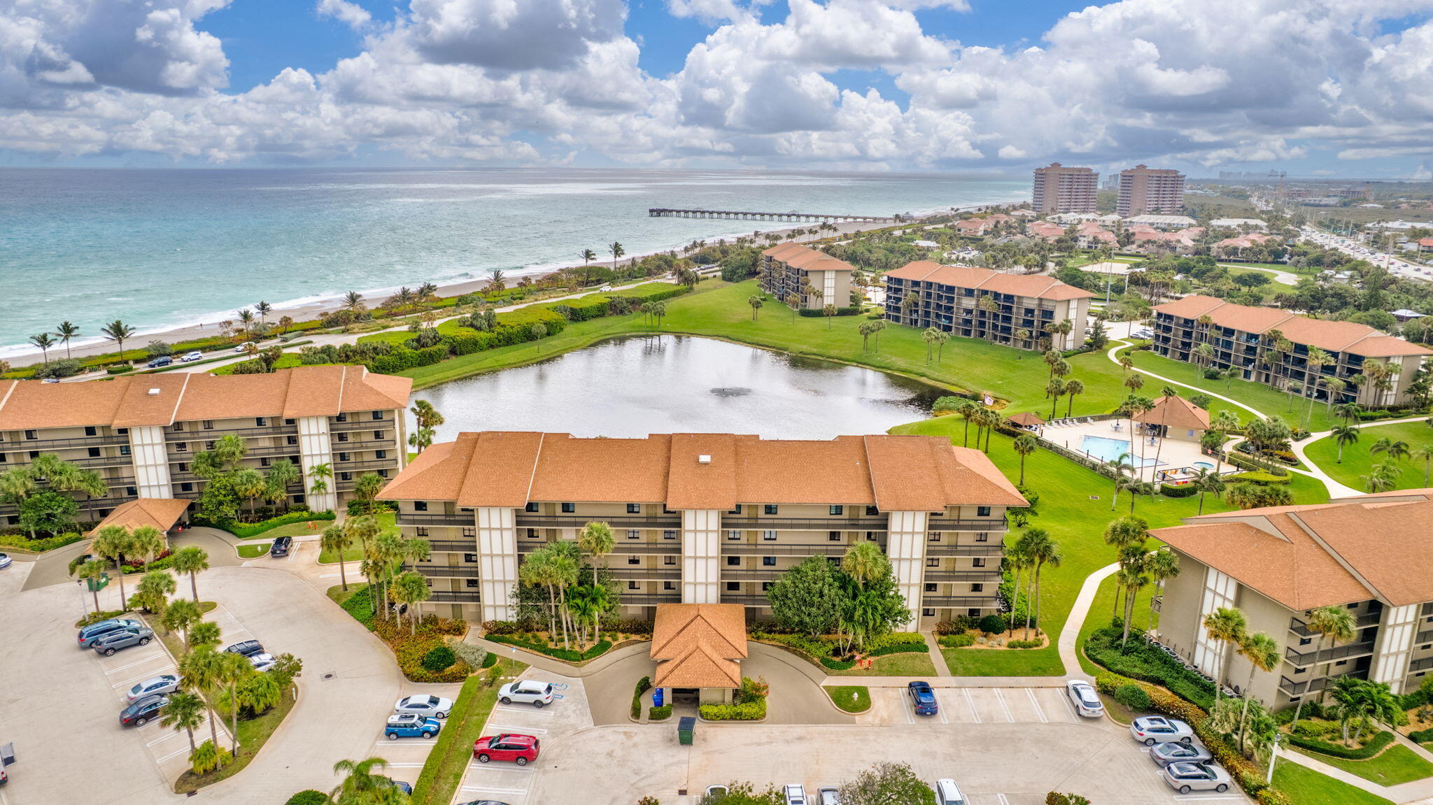 201 South Seas Drive, Unit 302 Jupiter, FL 33477 - Photo 4 of 19 an aerial view of residential houses and outdoor space