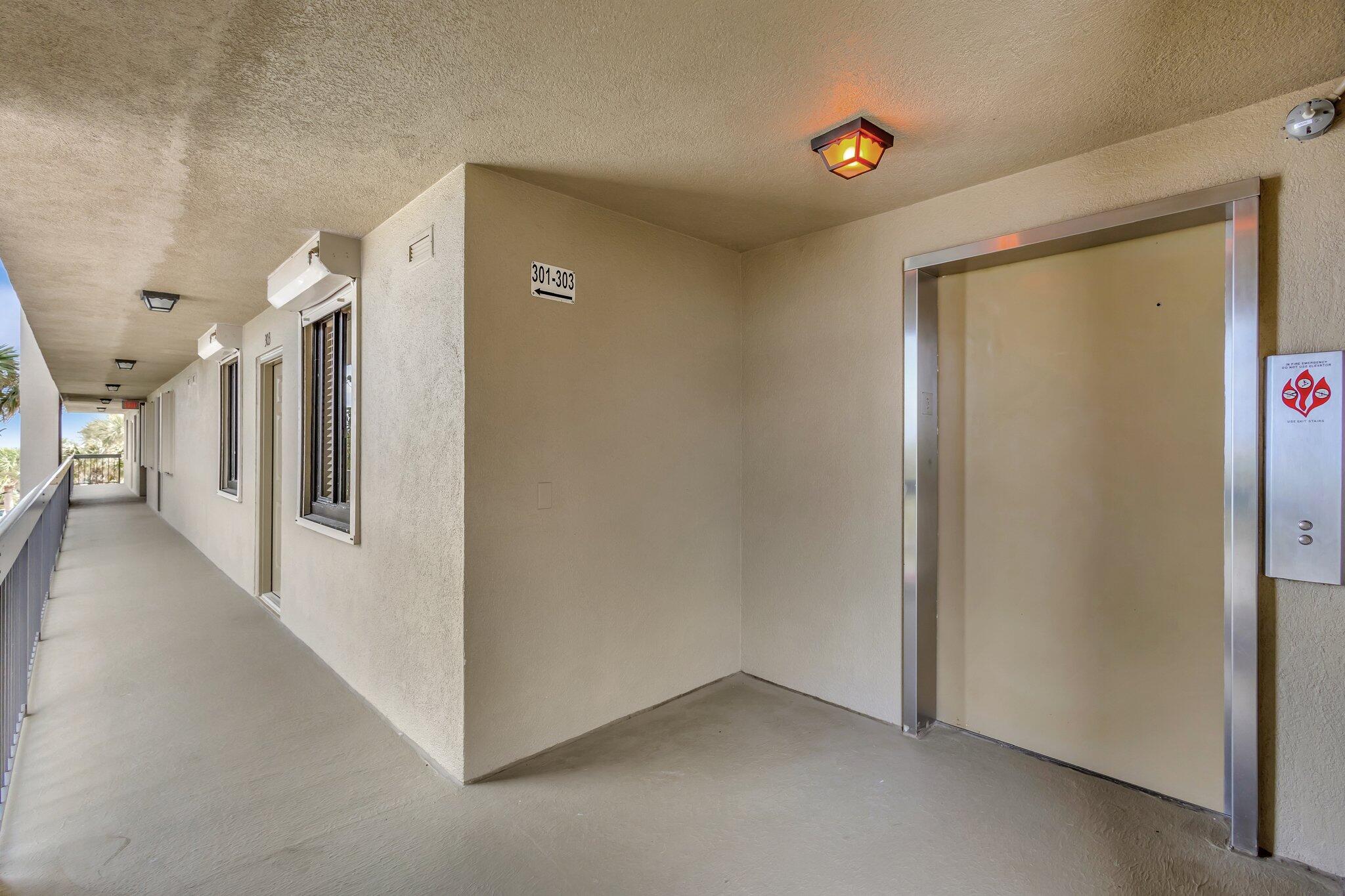 201 South Seas Drive, Unit 302 Jupiter, FL 33477 - Photo 6 of 19 a view of a hallway with entryway