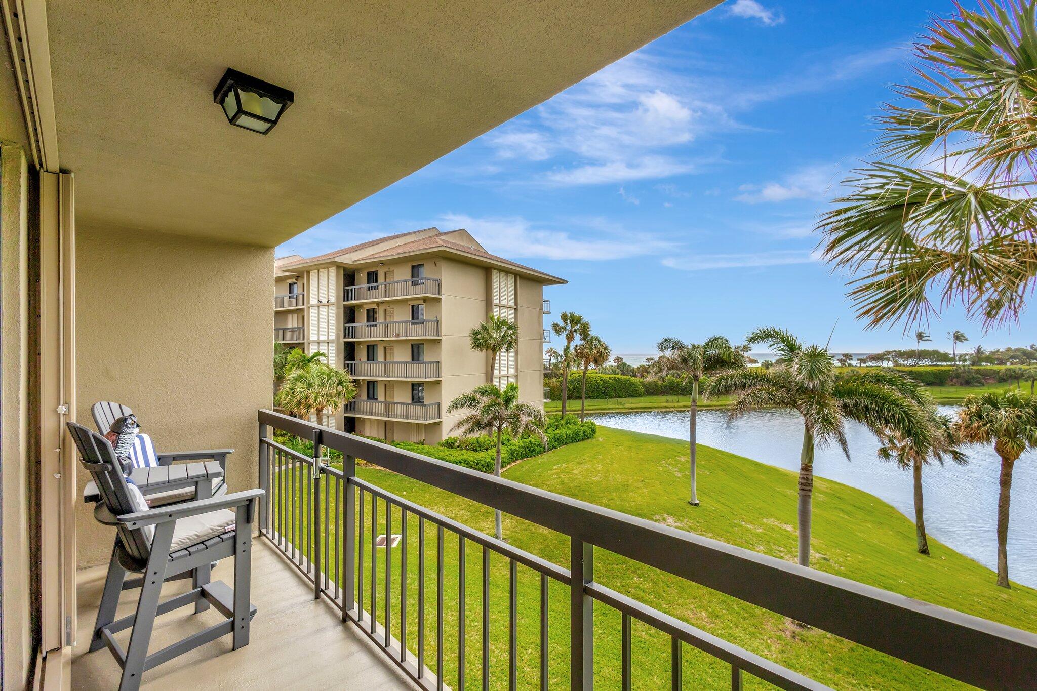201 South Seas Drive, Unit 302 Jupiter, FL 33477 - Photo 7 of 19 a view of a chairs and table in a balcony