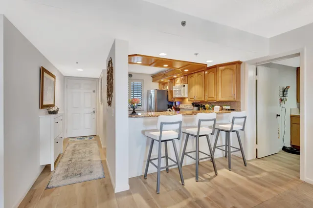 a kitchen with sink stove and cabinets