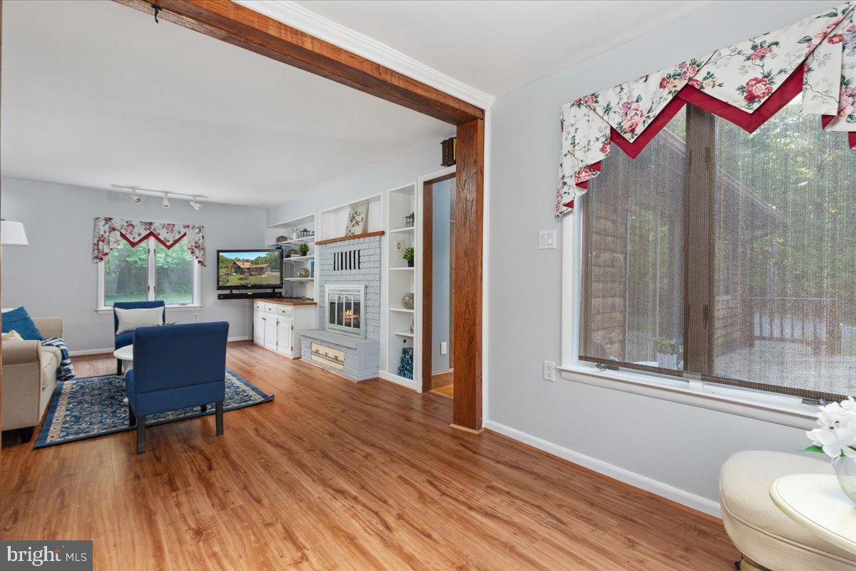 146 Lizzie Mills Road Castleton, VA 22716 - Photo 20 of 91 a living room with furniture and a wooden floor