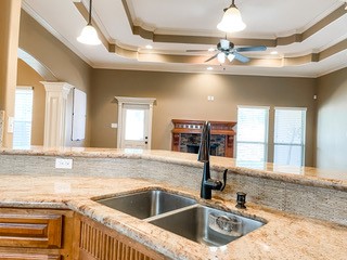 1306 Keenland Road Corpus Christi, TX 78418 - Photo 19 of 26 a kitchen with a sink and a stove