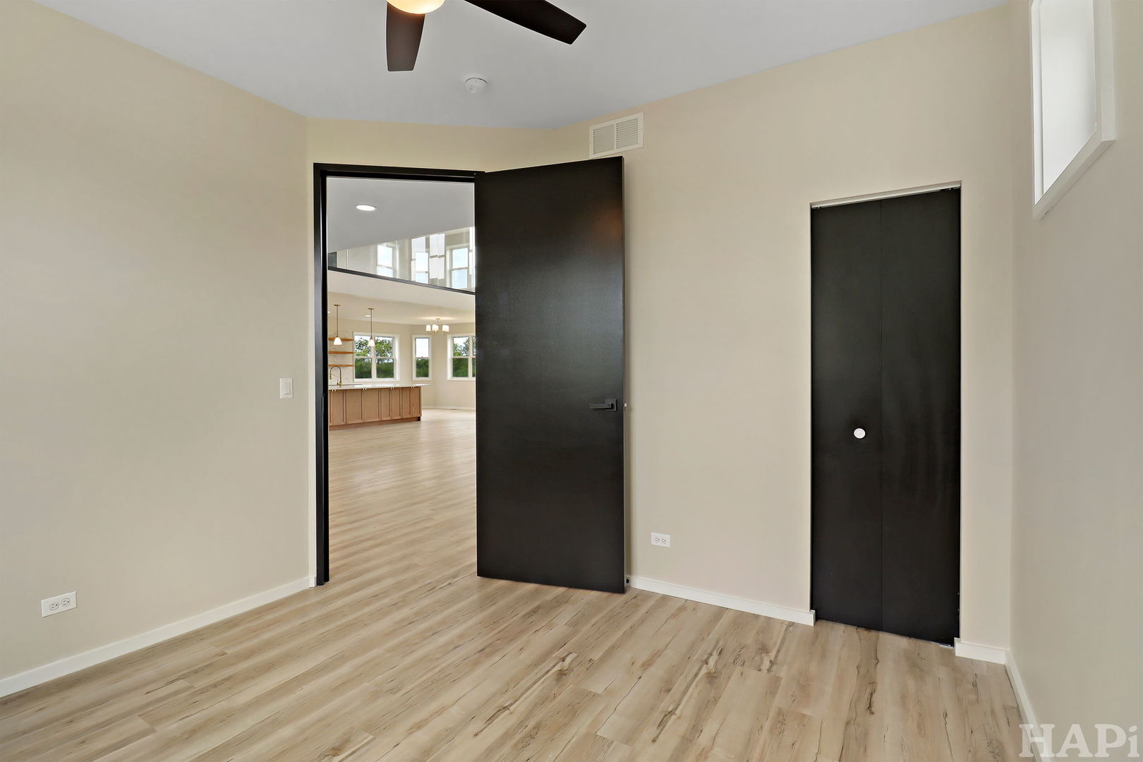 7304 Briar Drive Spring Grove, IL 60081 - Photo 15 of 50 a view of an empty room with wooden floor and a window