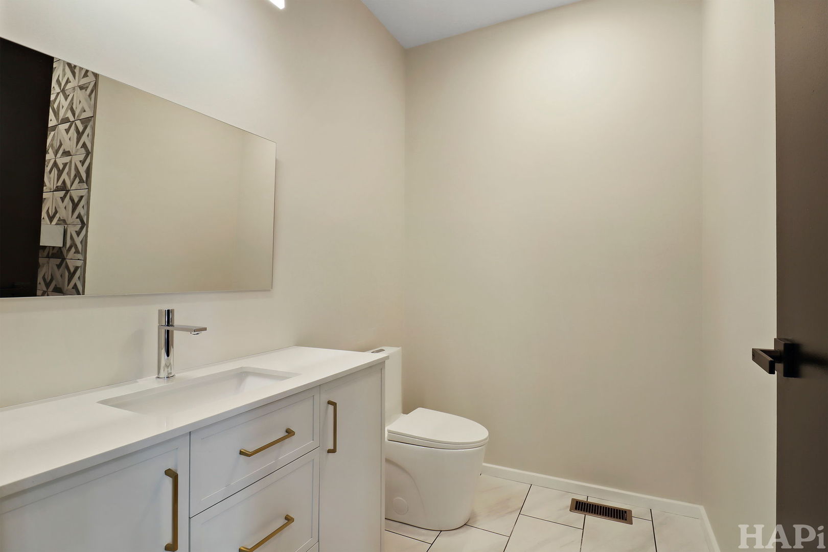 7304 Briar Drive Spring Grove, IL 60081 - Photo 16 of 50 a bathroom with a sink a toilet and mirror