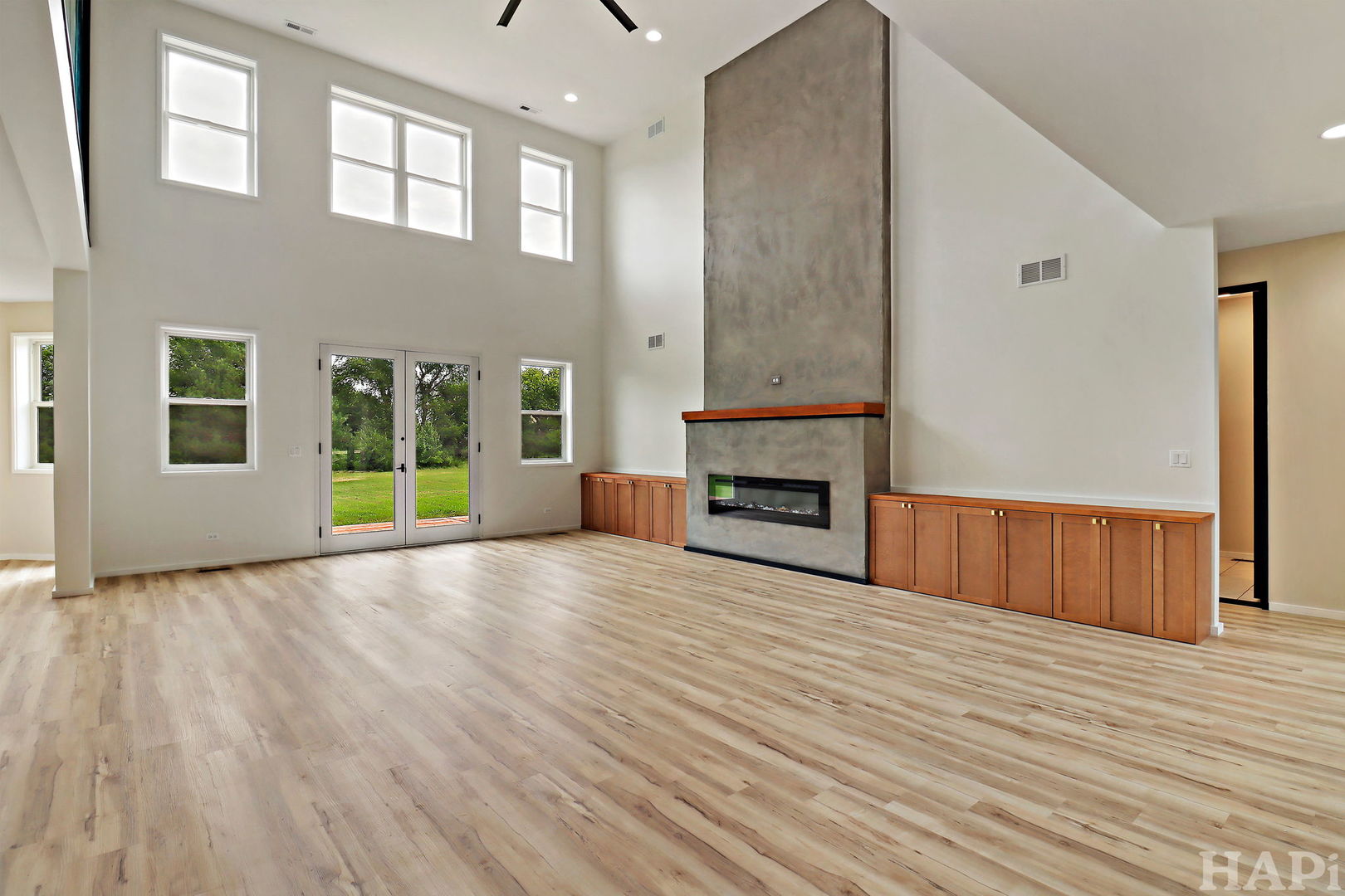 7304 Briar Drive Spring Grove, IL 60081 - Photo 7 of 50 a view of empty room with wooden floor and fireplace