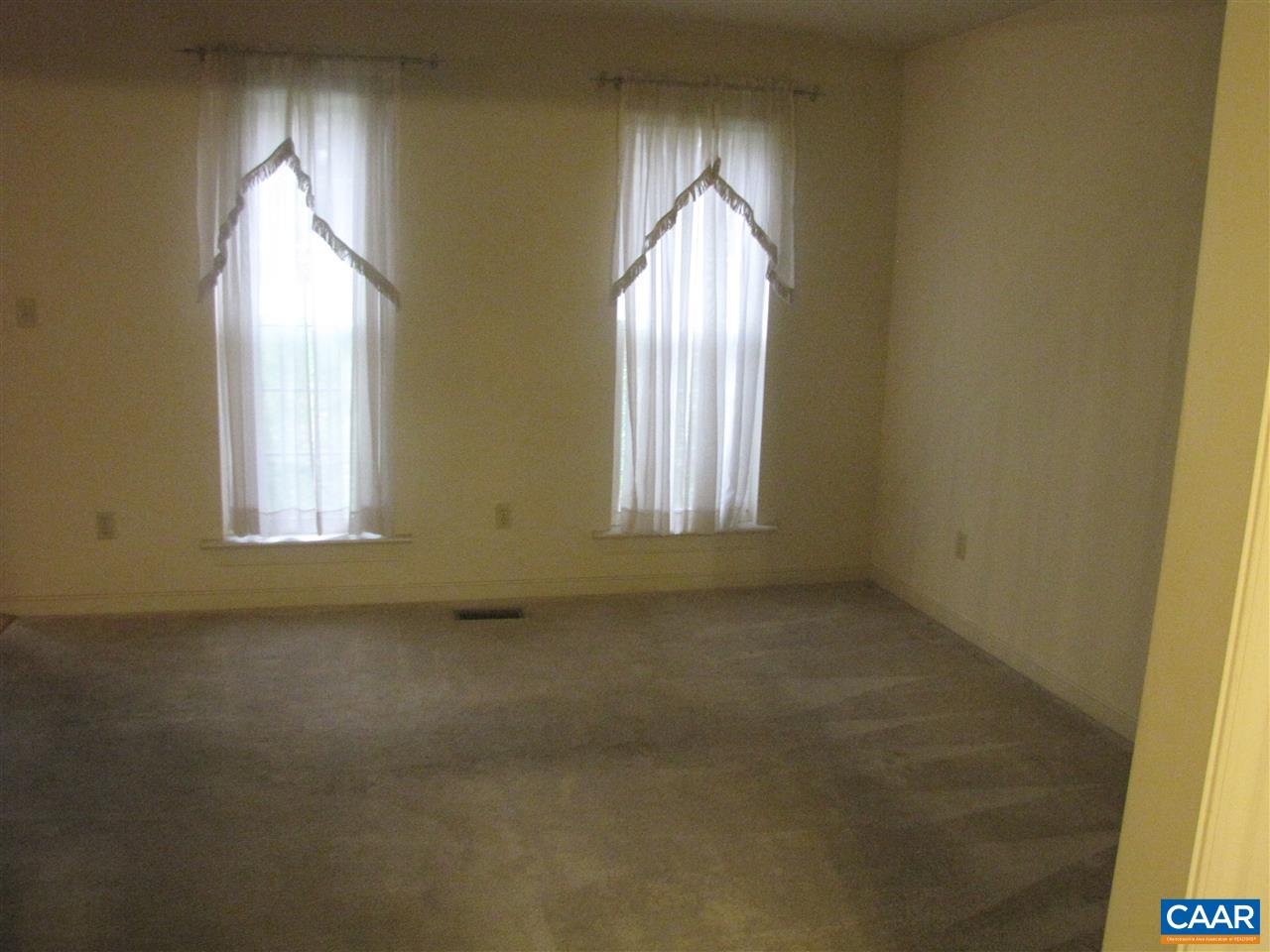 133 Jordan Store Road Kents Store, VA 23084 - Photo 5 of 7 an empty room with windows and painted walls