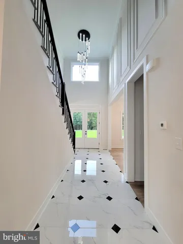 a view of hall way with furniture