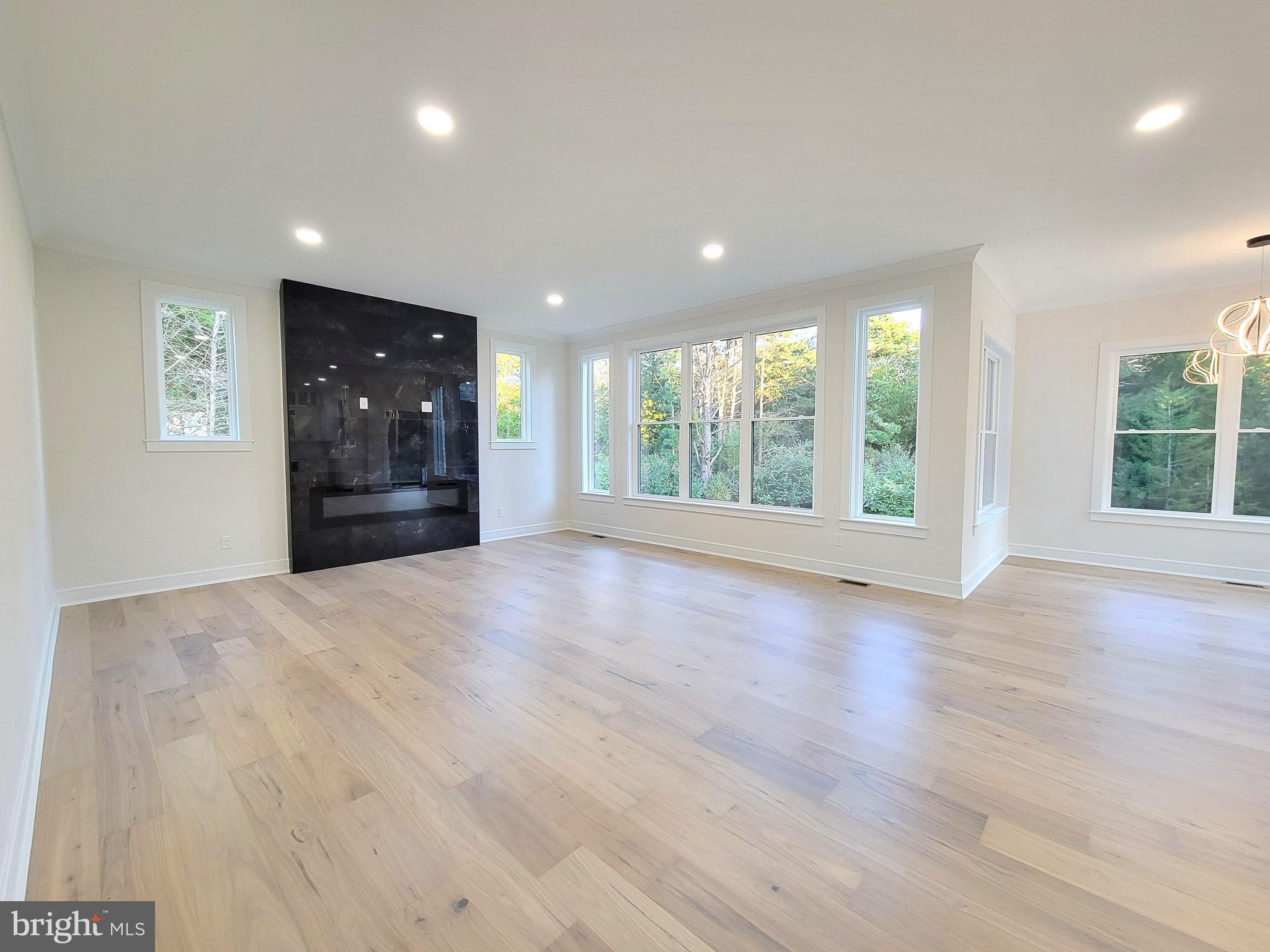 4517 Ascher Road Vineland, NJ 08361 - Photo 26 of 52 a view of an empty room with wooden floor and a window