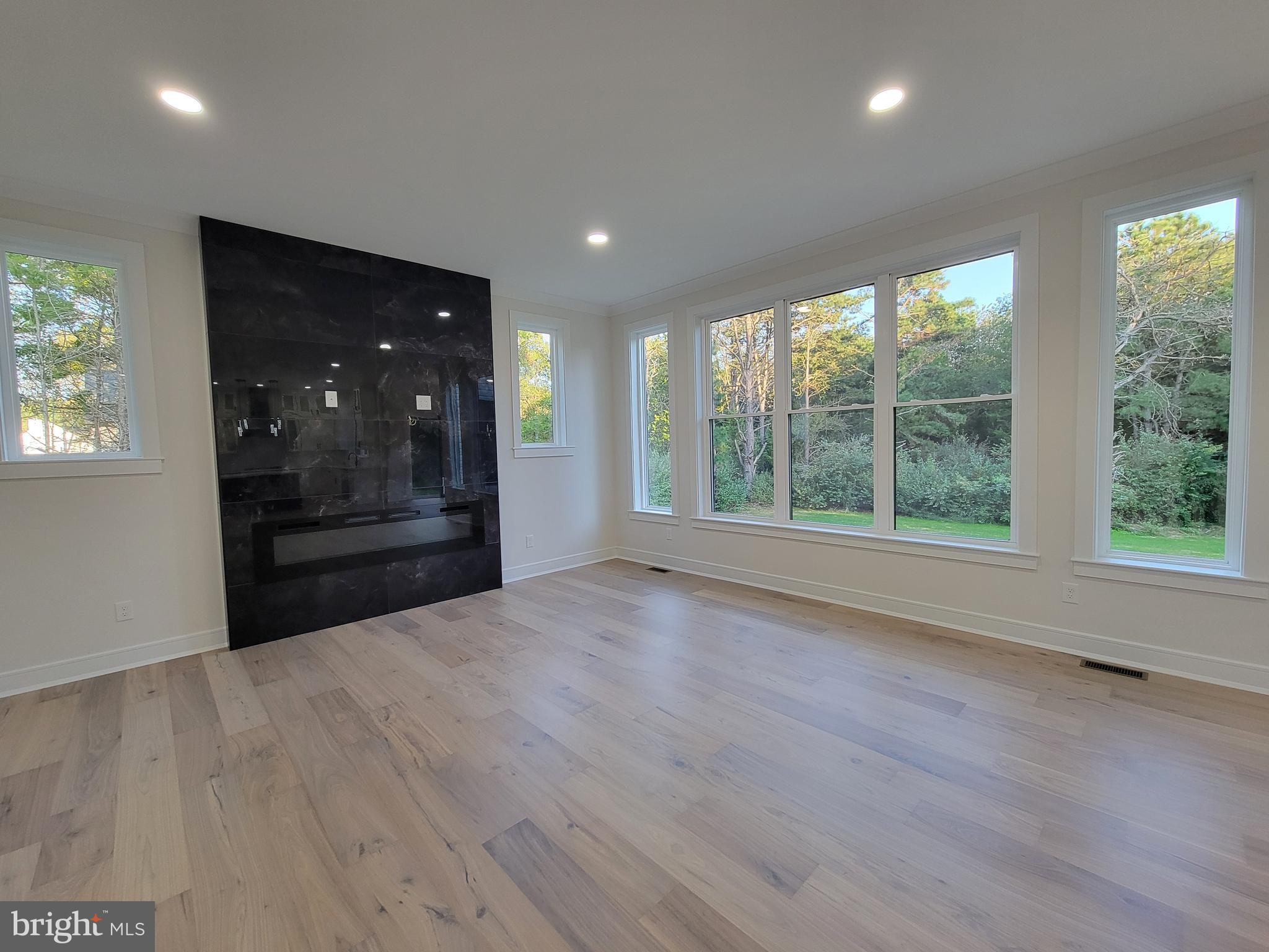 4517 Ascher Road Vineland, NJ 08361 - Photo 28 of 52 an empty room with wooden floor and windows