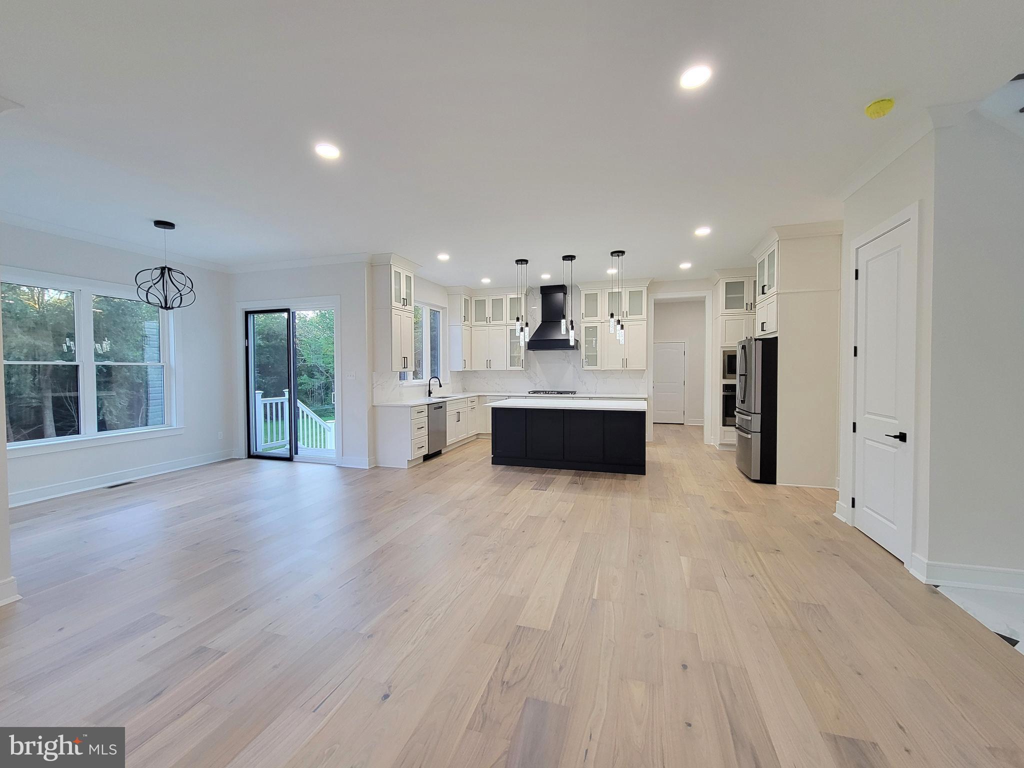 4517 Ascher Road Vineland, NJ 08361 - Photo 29 of 52 a view of a big room with wooden floor and windows