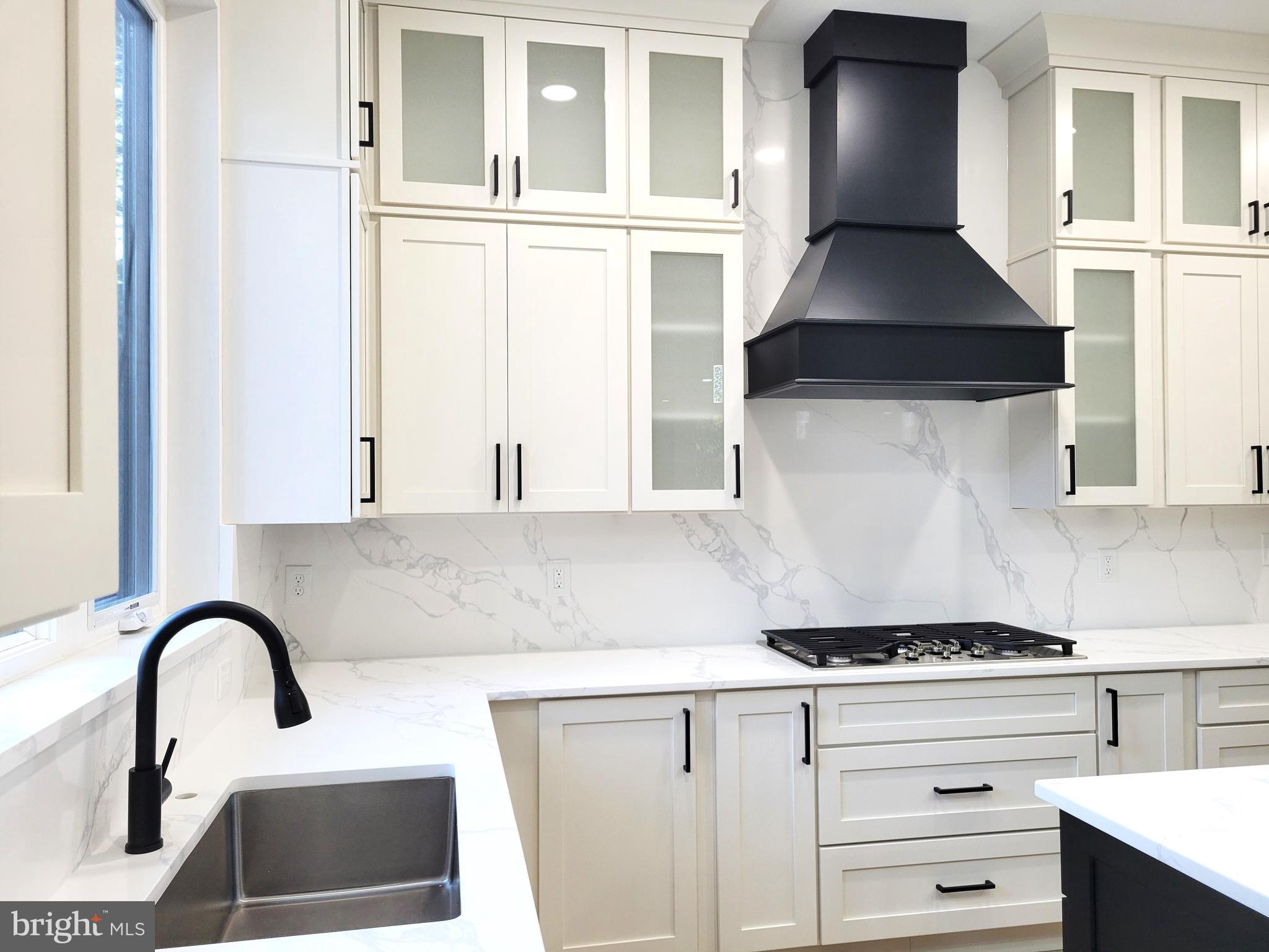 4517 Ascher Road Vineland, NJ 08361 - Photo 33 of 52 a kitchen with granite countertop a stove and a sink
