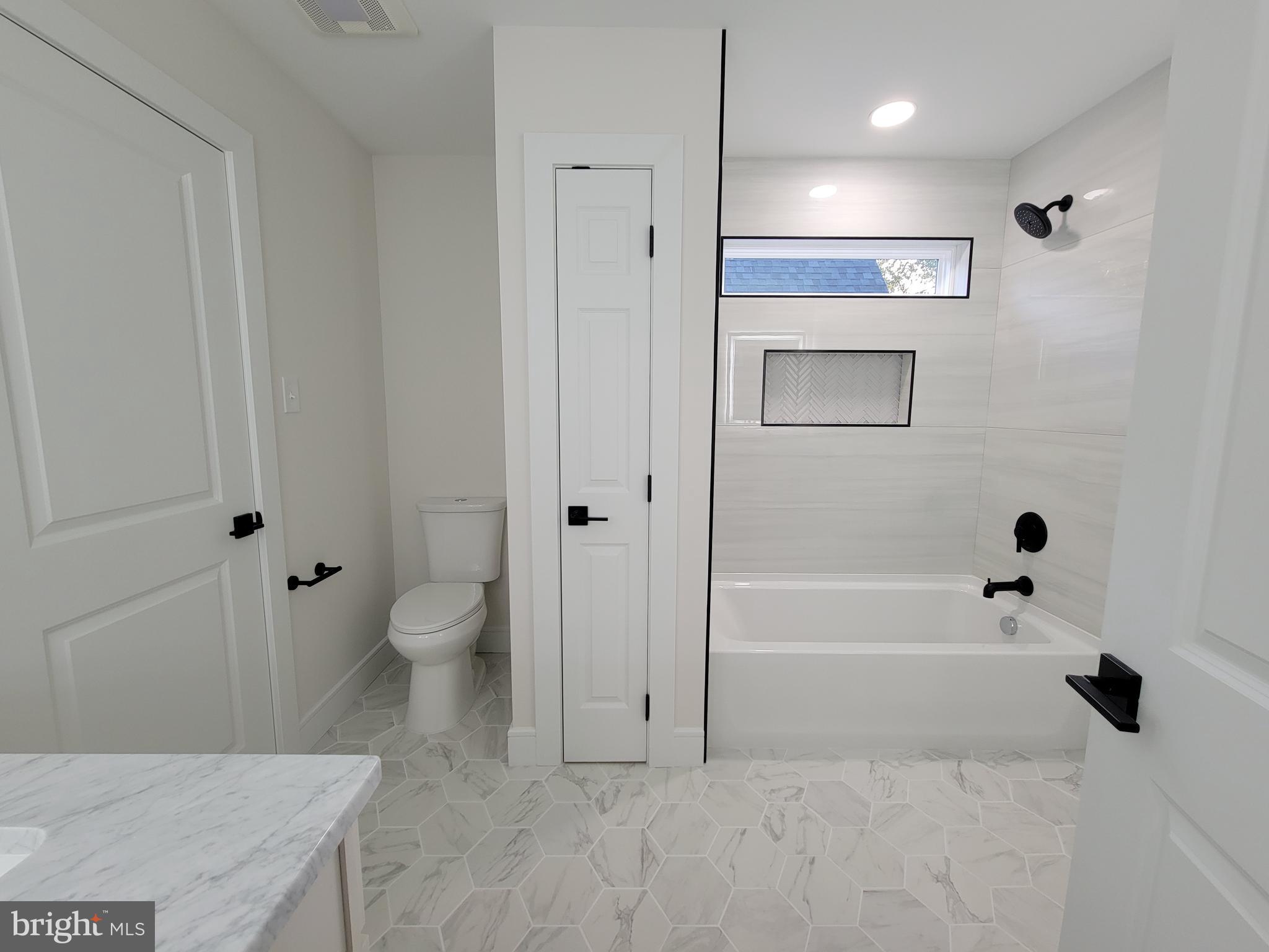 4517 Ascher Road Vineland, NJ 08361 - Photo 42 of 52 a bathroom with a bathtub toilet and a shower