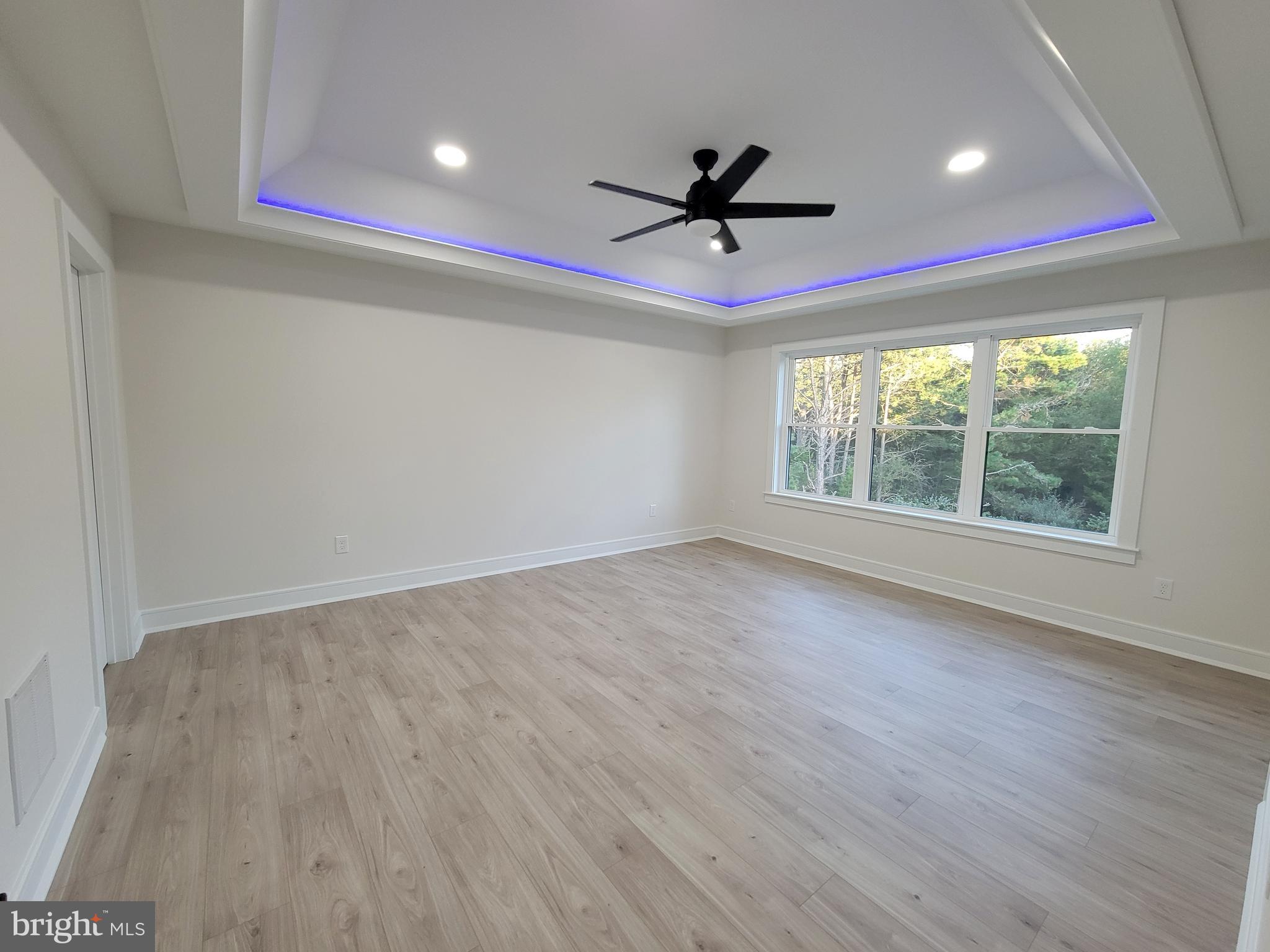 4517 Ascher Road Vineland, NJ 08361 - Photo 47 of 52 a view of empty room with wooden floor and fan