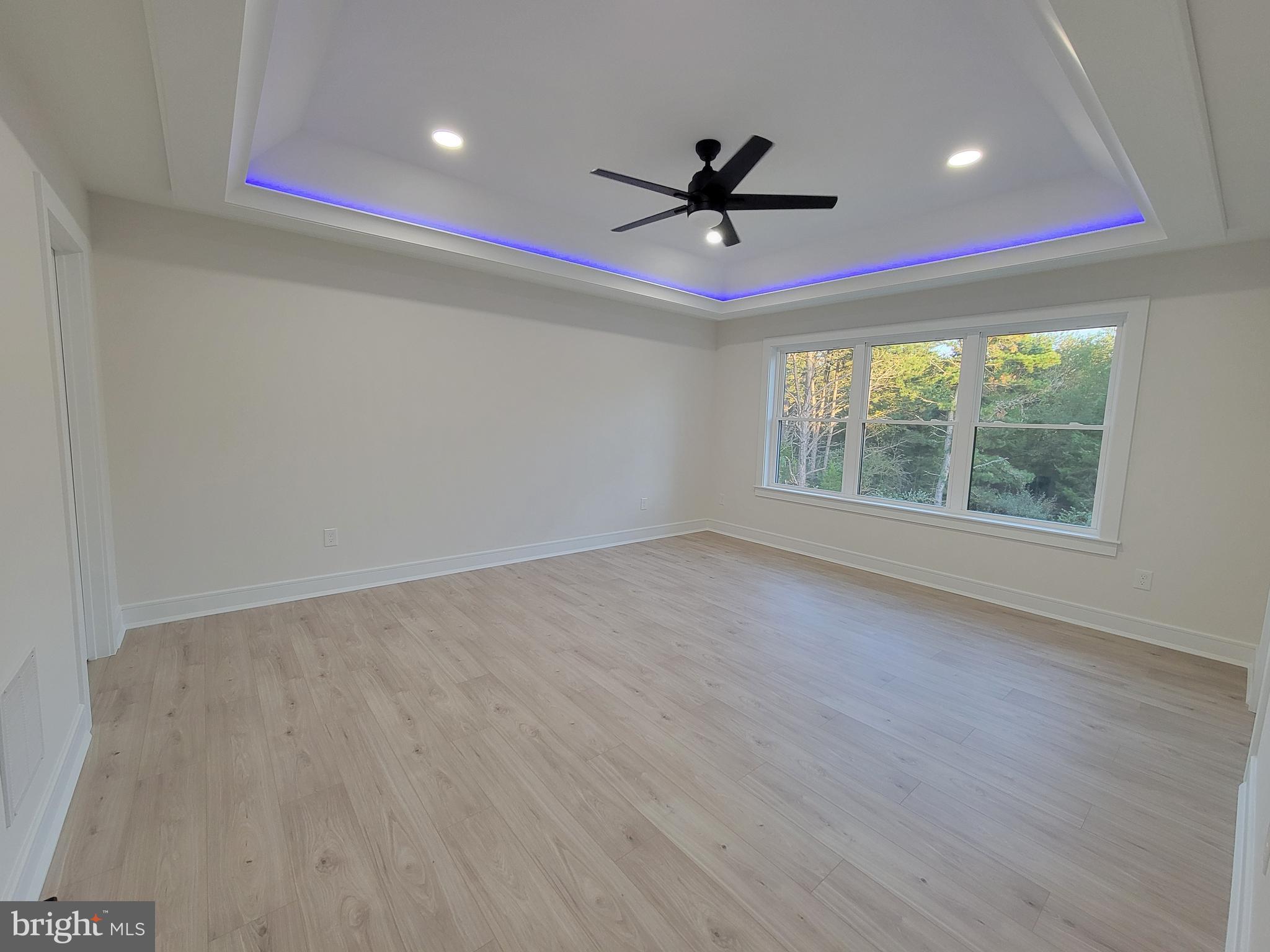 4517 Ascher Road Vineland, NJ 08361 - Photo 48 of 52 an empty room with wooden floor fan and windows