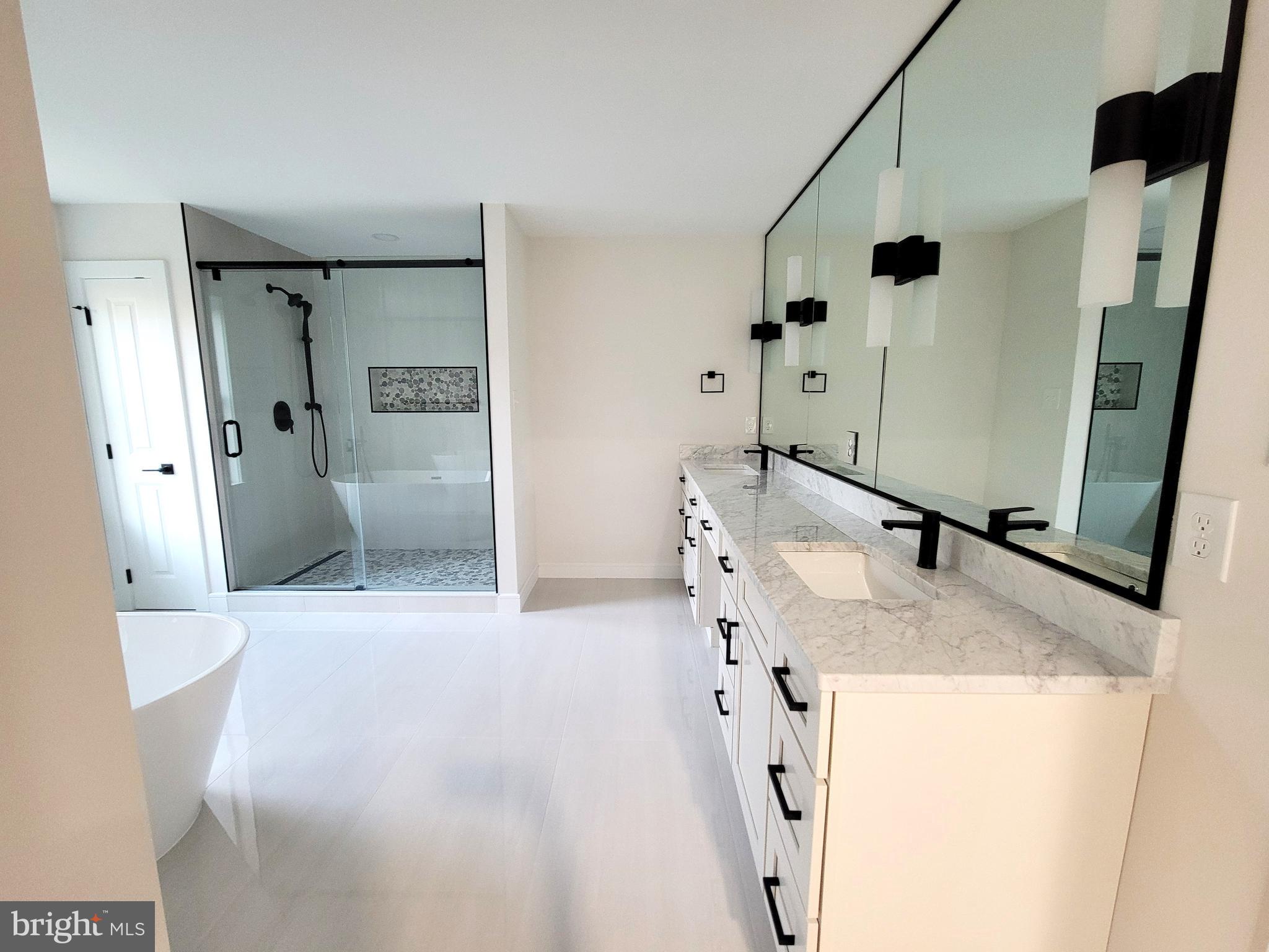 4517 Ascher Road Vineland, NJ 08361 - Photo 50 of 52 a bathroom with a granite countertop sink a mirror and shower