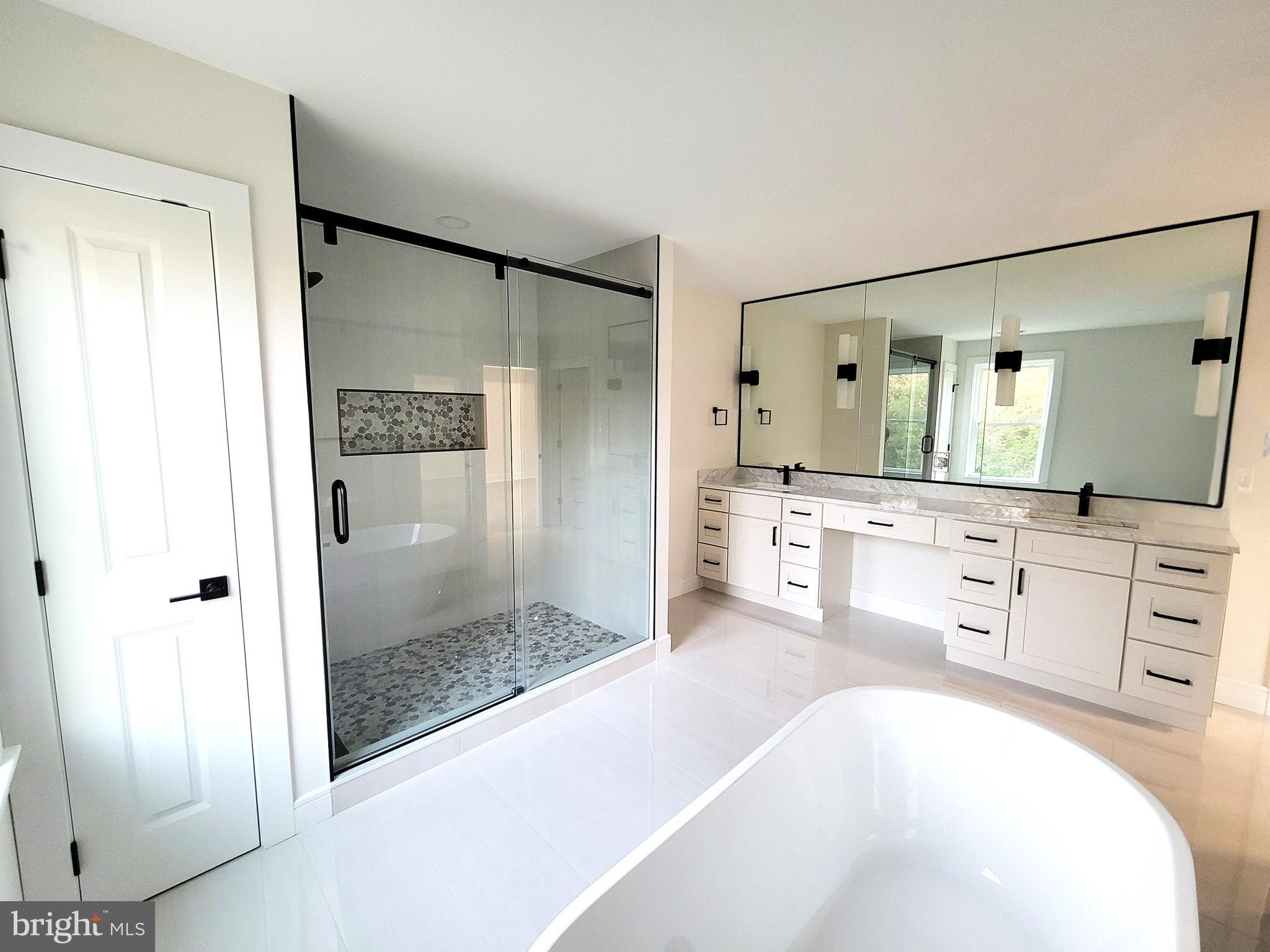 4517 Ascher Road Vineland, NJ 08361 - Photo 52 of 52 a bathroom with a tub sink shower and mirror