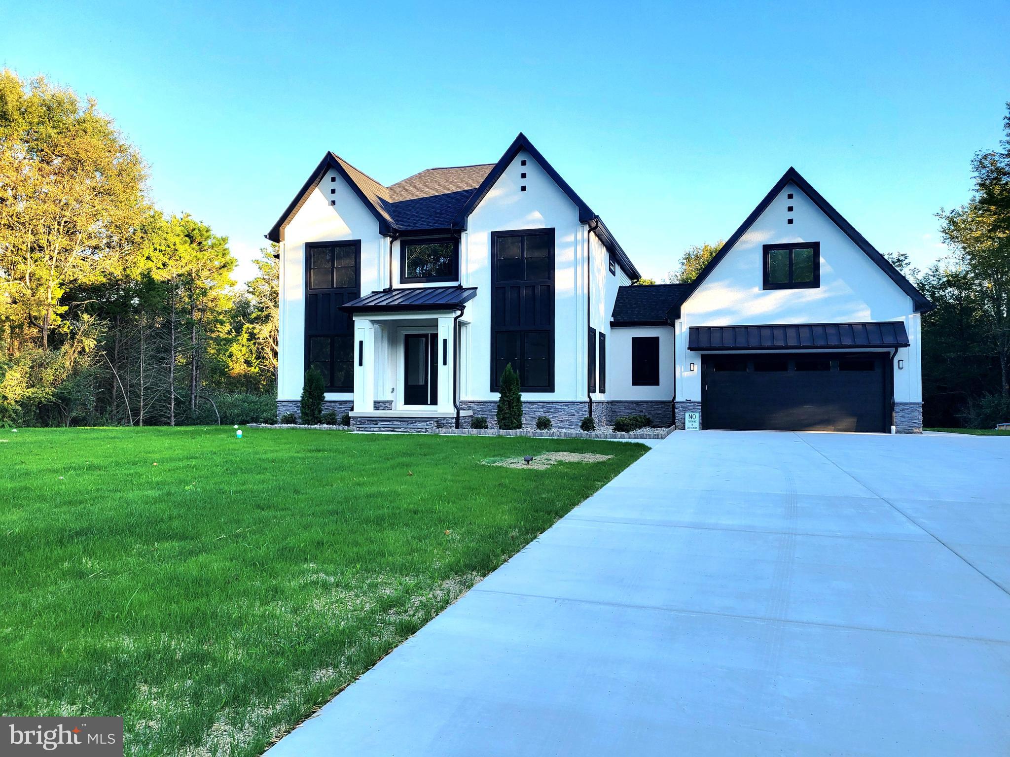 4517 Ascher Road Vineland, NJ 08361 - Photo 6 of 52 a front view of a house with a yard and garage