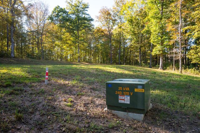a sign board with a yard