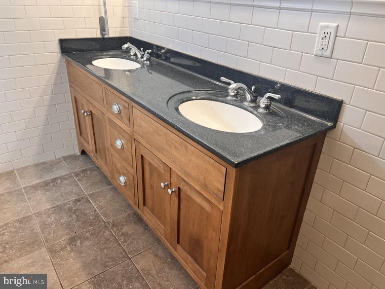 406 West Market Street Georgetown, DE 19947 - Photo 12 of 16 Elegant dual-sink vanity design.