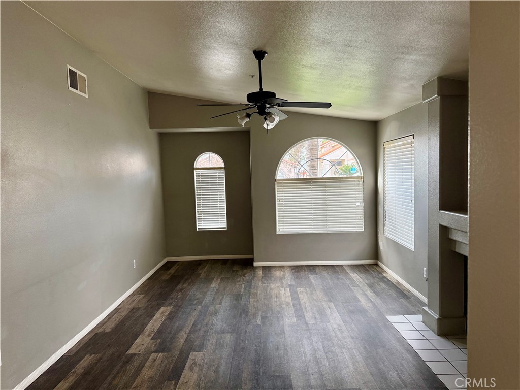 372 Via Capri Hemet, CA 92545 - Photo 11 of 27 wooden floor in an empty room with a window