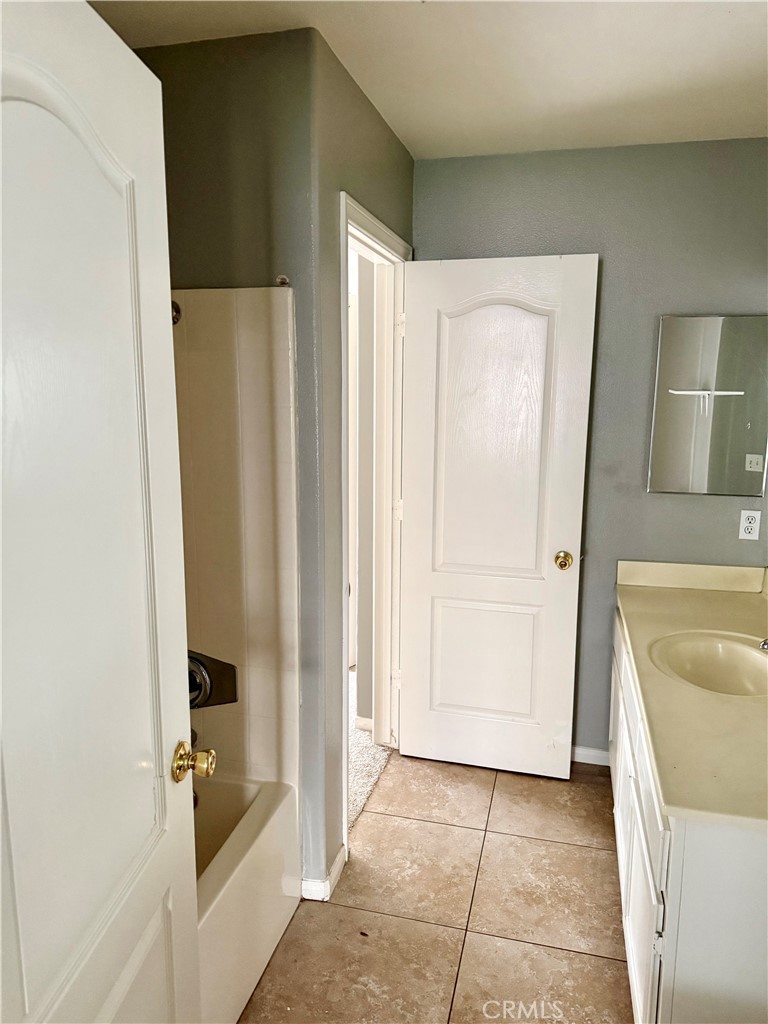 372 Via Capri Hemet, CA 92545 - Photo 16 of 27 a bathroom with a tub and shower