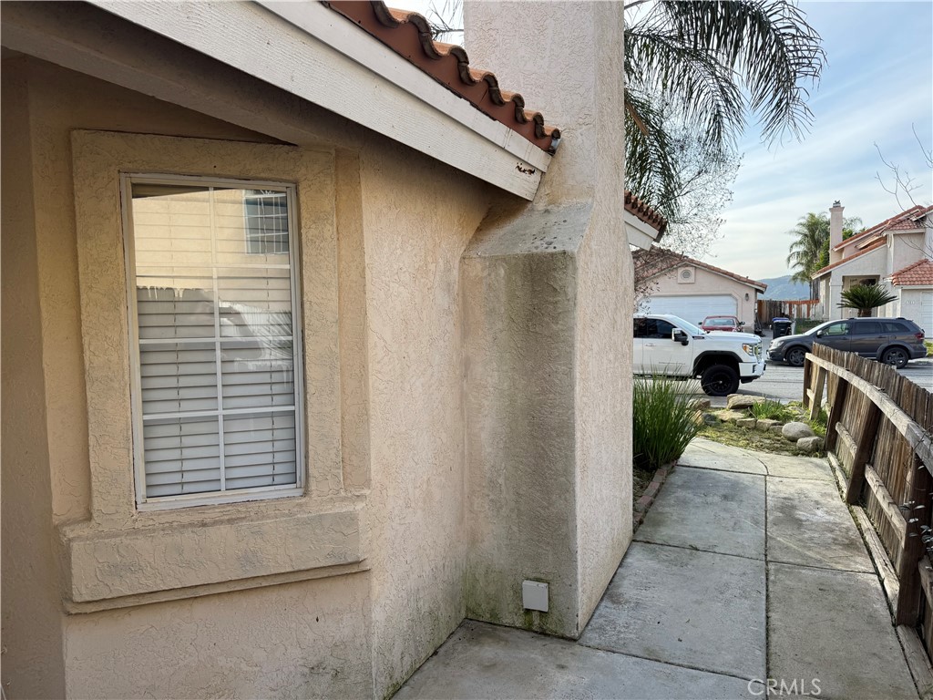 372 Via Capri Hemet, CA 92545 - Photo 25 of 27 a view of a house with a backyard and a window