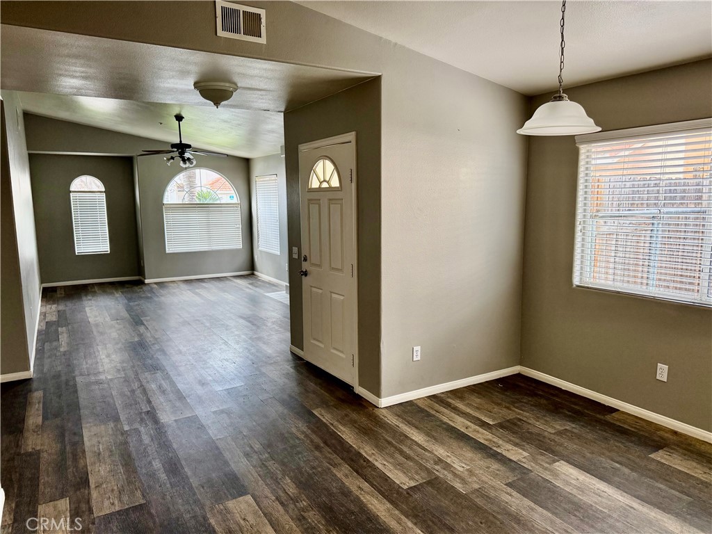 372 Via Capri Hemet, CA 92545 - Photo 5 of 27 a view of a room with wooden floor and windows
