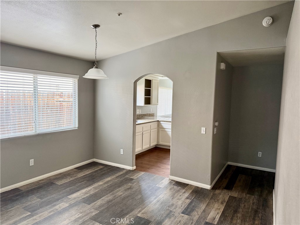 372 Via Capri Hemet, CA 92545 - Photo 10 of 27 a view of a room with wooden floor and a window