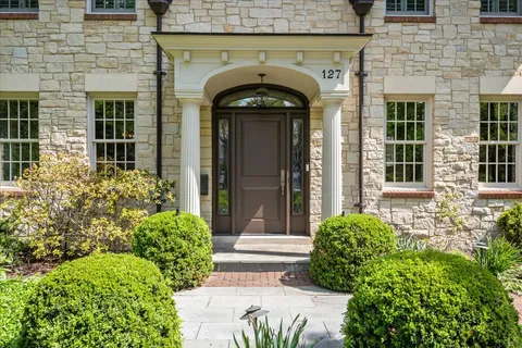 a front view of a house with garden