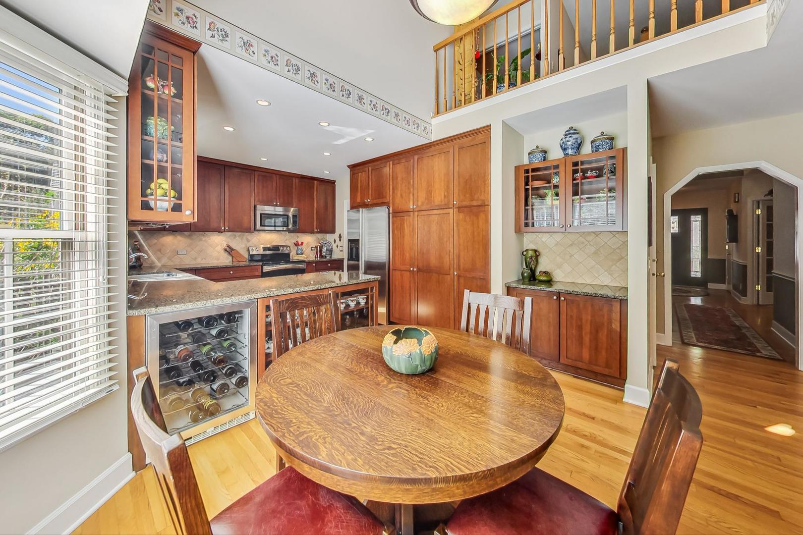 4763 Middle Road Gurnee, IL 60031 - Photo 11 of 47 a kitchen with a table chairs and wooden floor