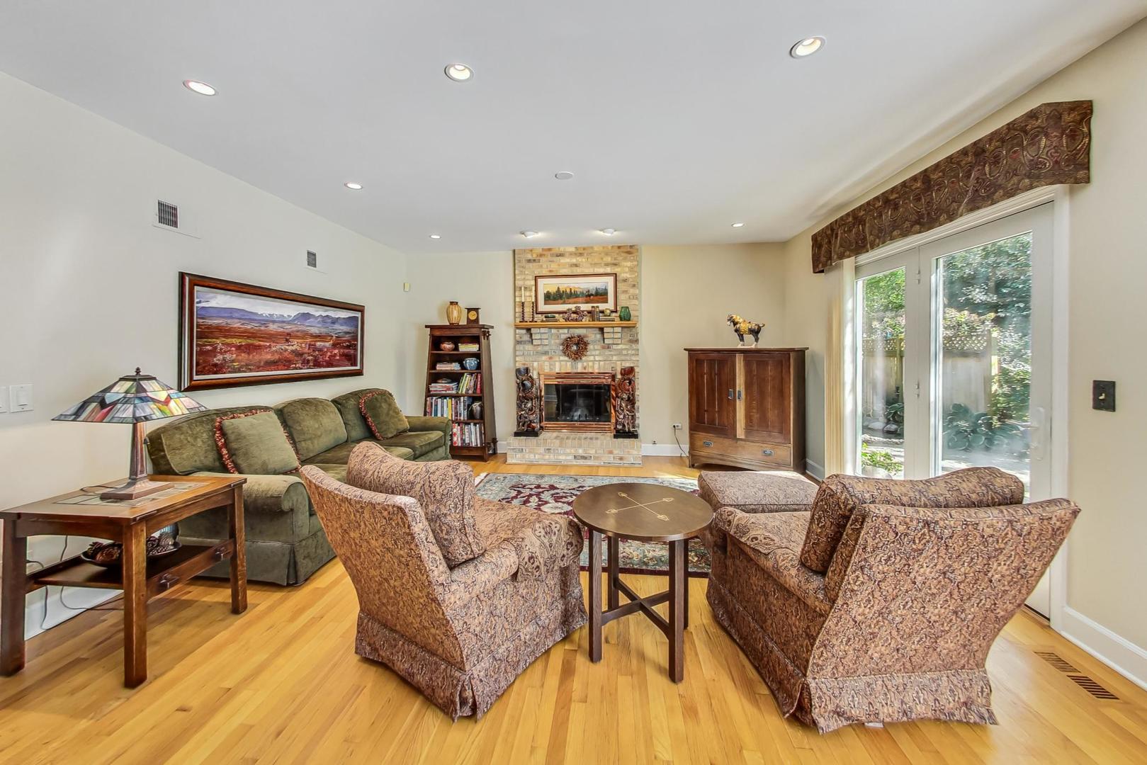 4763 Middle Road Gurnee, IL 60031 - Photo 12 of 47 a living room with fireplace furniture and a large window