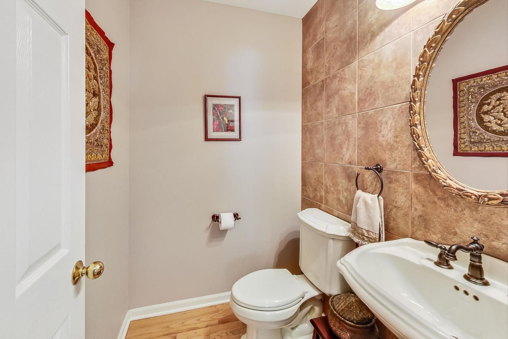 4763 Middle Road Gurnee, IL 60031 - Photo 16 of 47 a bathroom with a sink mirror and toilet