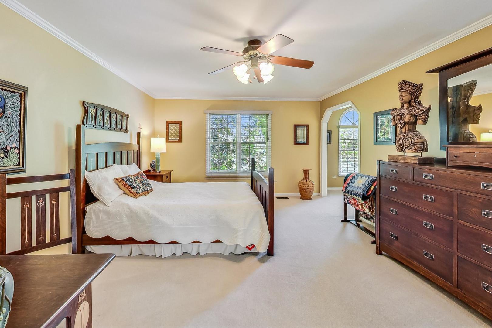 4763 Middle Road Gurnee, IL 60031 - Photo 18 of 47 a bed room with a bed and a dresser
