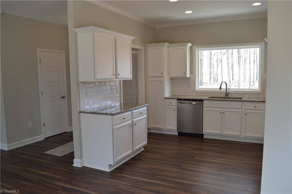 486 Price Farm Road Stokesdale, NC 27357 - Photo 4 of 15 View of Kitchen & Foyer from Dining Area