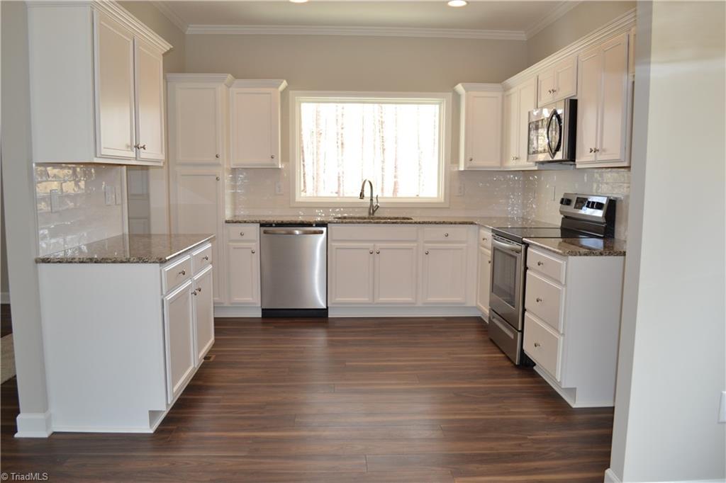 486 Price Farm Road Stokesdale, NC 27357 - Photo 5 of 15 View of Kitchen from Dining Area