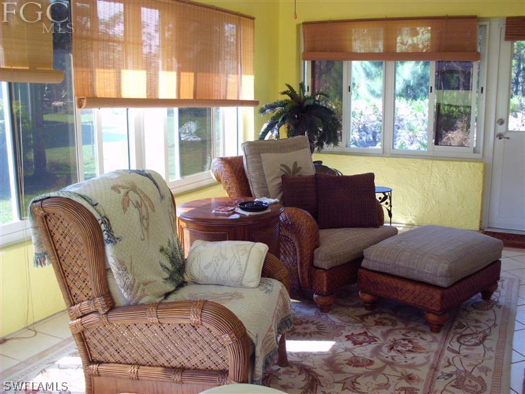 5919 Tarpon Road Bokeelia, FL 33922 - Photo 4 of 14 a living room with furniture and a large window