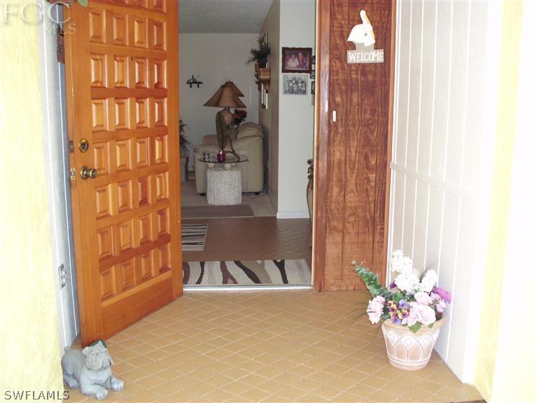 5919 Tarpon Road Bokeelia, FL 33922 - Photo 5 of 14 a view of front door