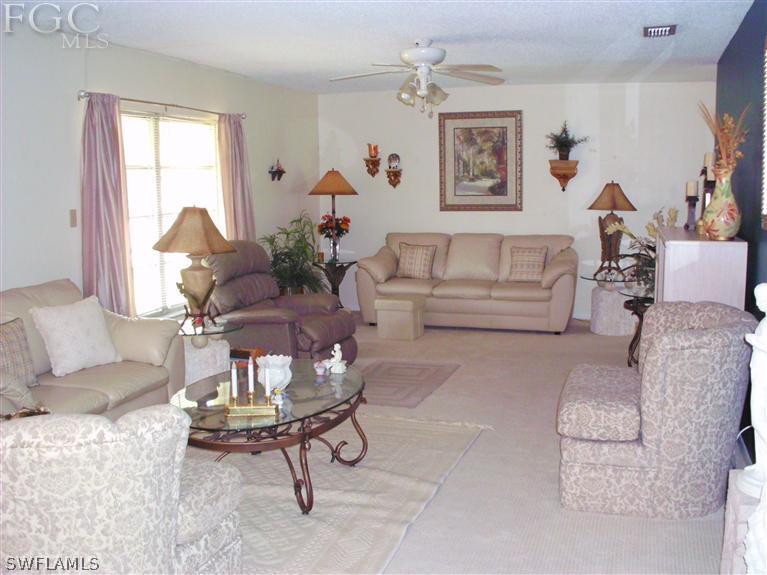 5919 Tarpon Road Bokeelia, FL 33922 - Photo 7 of 14 a living room with furniture or couch and a window