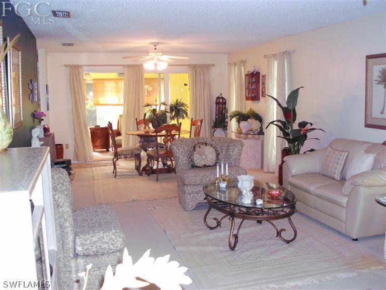 5919 Tarpon Road Bokeelia, FL 33922 - Photo 8 of 14 a living room with furniture and a large window