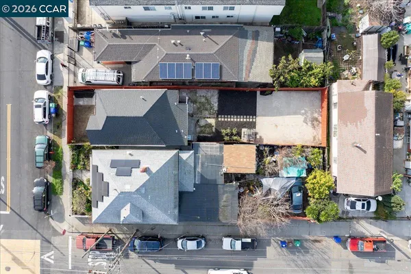 an aerial view of multiple houses with outdoor space