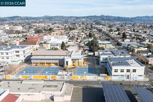 an aerial view of residential houses with street