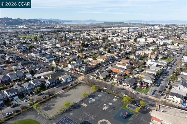 an aerial view of residential houses and outdoor space