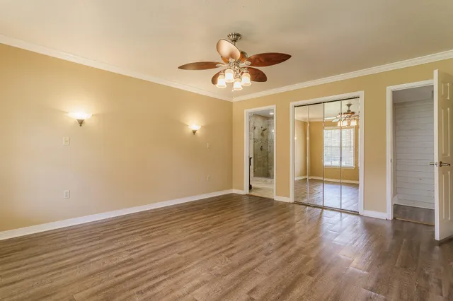 a bathroom with a granite countertop shower sink and mirror