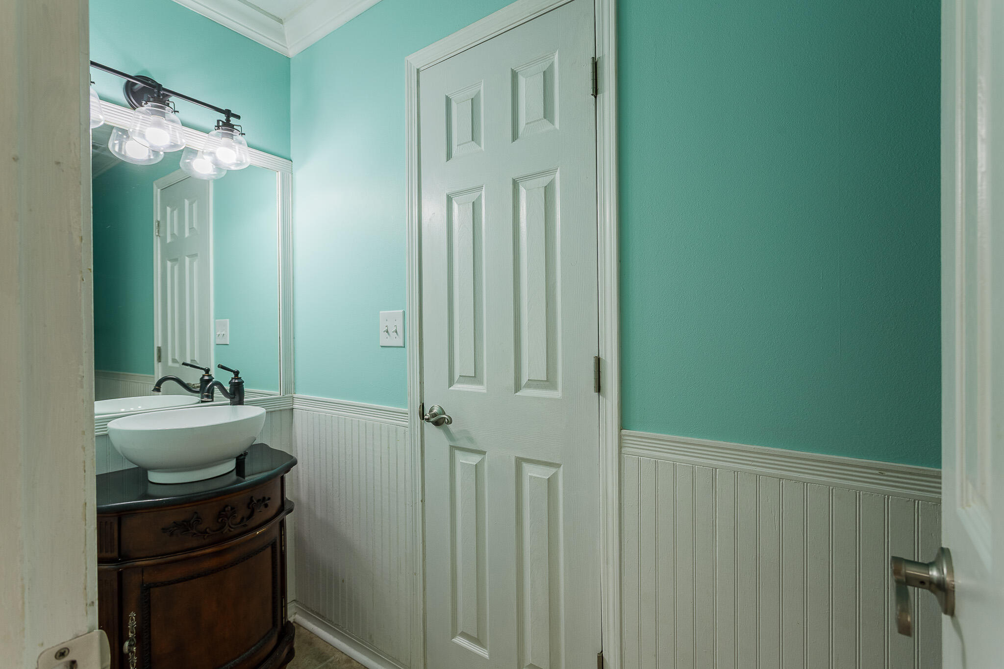 329 Skyline Circle Crestview, FL 32539 - Photo 16 of 28 a bathroom with a sink and a mirror